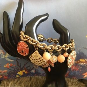 Gold tone chain link beach charm theme bracelet